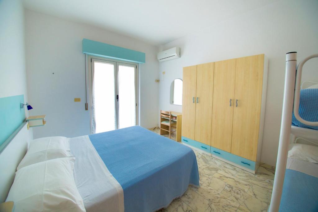 Postel nebo postele na pokoji v ubytování Albergo Il Veliero