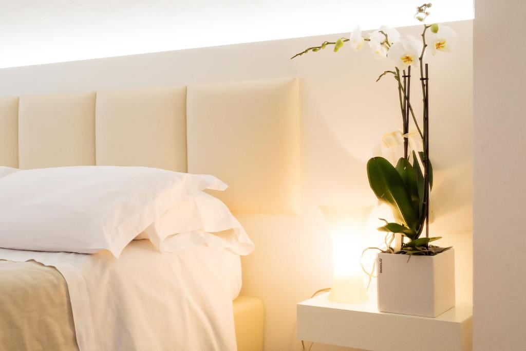 Кровать или кровати в номере Hotel Rosmarina