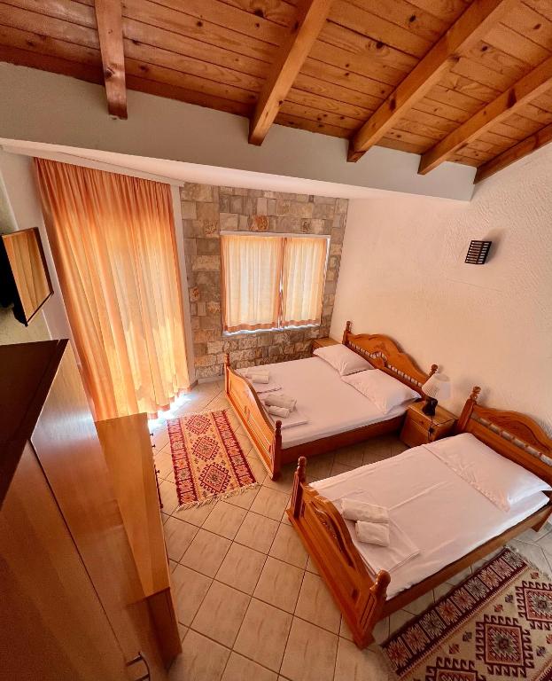 Ένα ή περισσότερα κρεβάτια σε δωμάτιο στο Apartments Amina