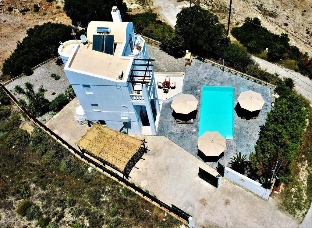 an aerial view of a house with umbrellas at Villa Aurora Dome in Afantou