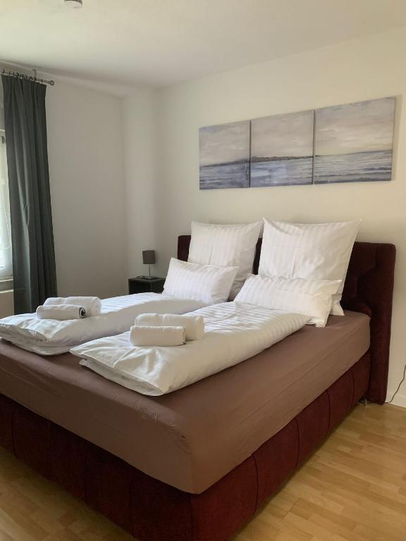 a large bed with two white pillows on it at Große Ferienwohnung im Spreewald Lübben 2,5km in Hartmannsdorf