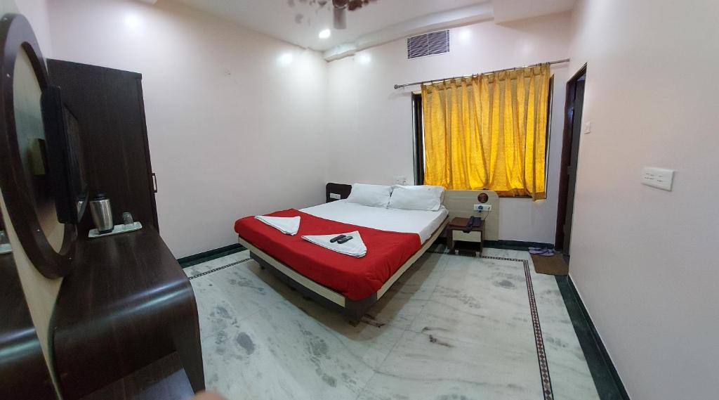 Postel nebo postele na pokoji v ubytování Hotel Gujrat