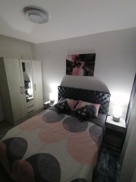 Postel nebo postele na pokoji v ubytování JM Apartman
