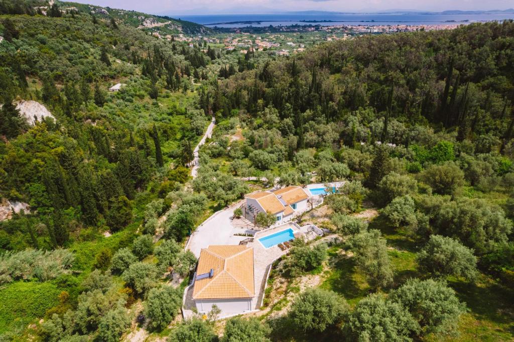 an aerial view of a house in the woods at Meliades villas in Apolpaina