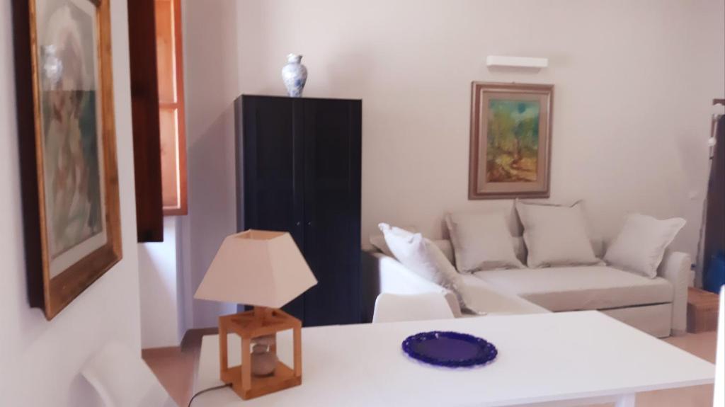 a living room with a couch and a table at Civico in Gubbio