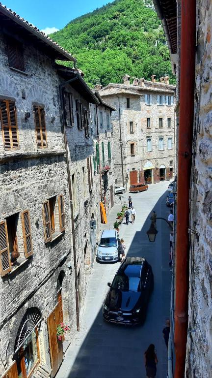 a view of a street with cars parked on the road at Civico in Gubbio