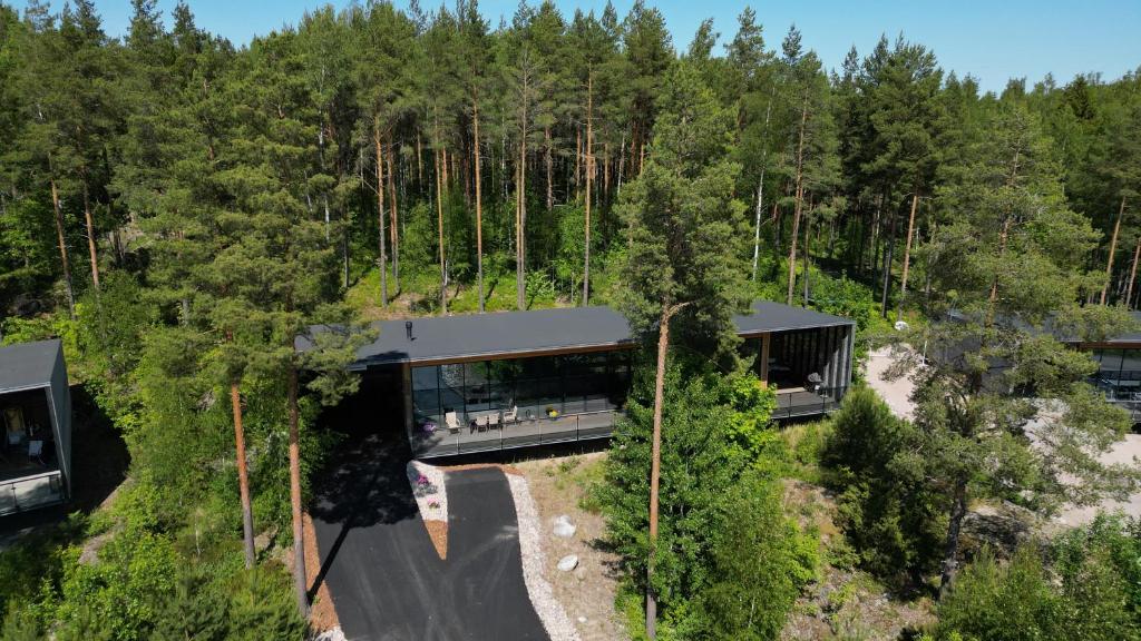 an aerial view of a house in the woods at Kartanonrinteen Amanda in Teijo