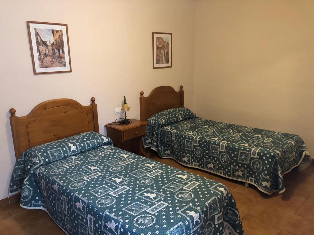 Postel nebo postele na pokoji v ubytování apartamentos casa botero