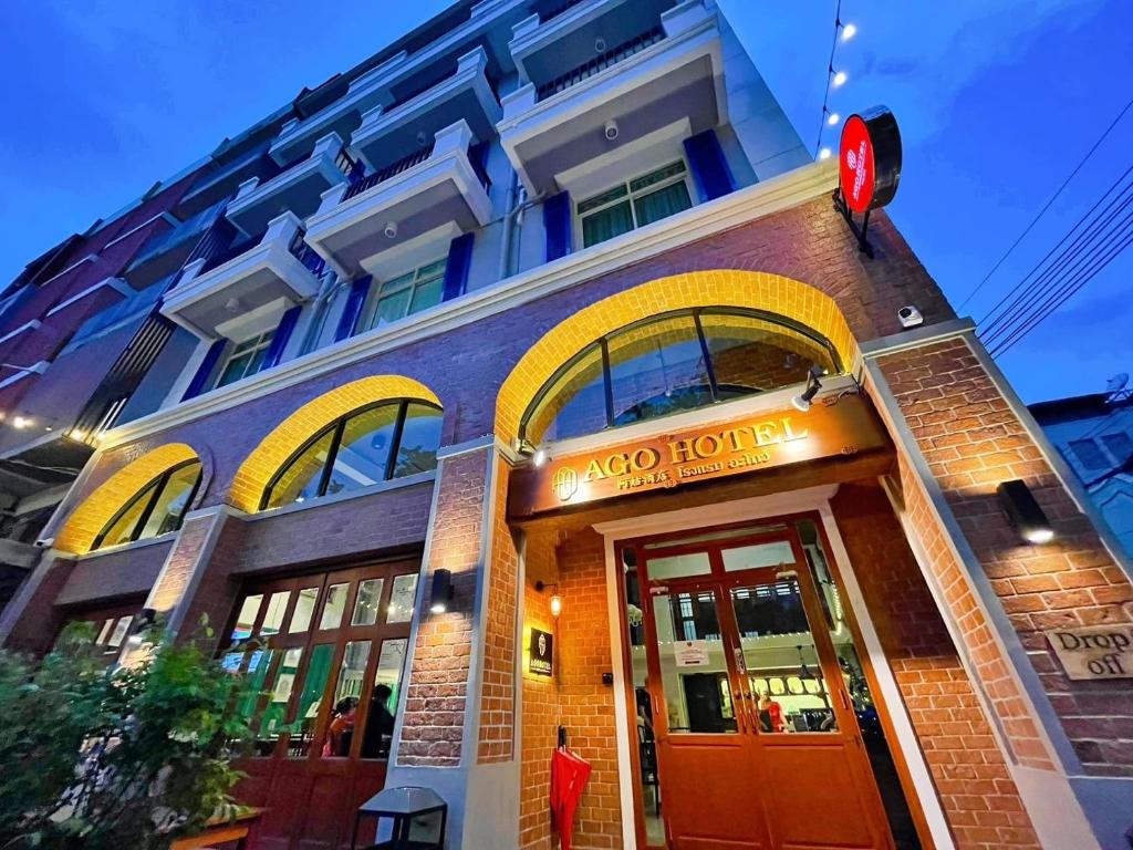 a building with a sign that reads kozo hotel at Ago Hotel Chinatown in Bangkok