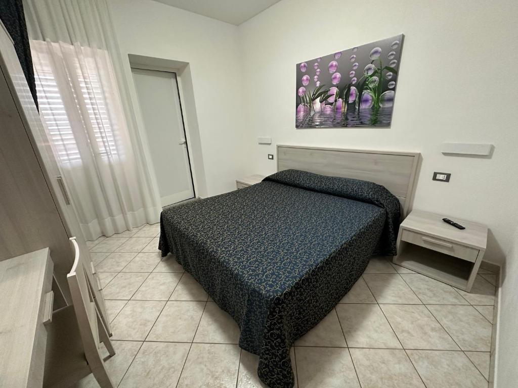 Postel nebo postele na pokoji v ubytování Hotel Barbarossa