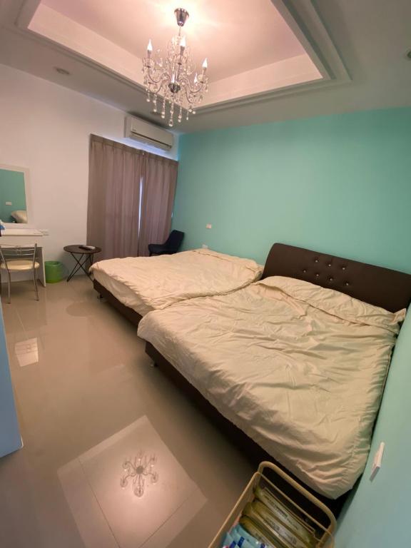 Postel nebo postele na pokoji v ubytování 葳葳民宿