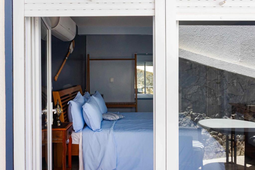 Postel nebo postele na pokoji v ubytování Pousada Santorini