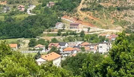 a village on a hill with houses and trees at Guesthouse Tropojë e Vjeter in Tropojë