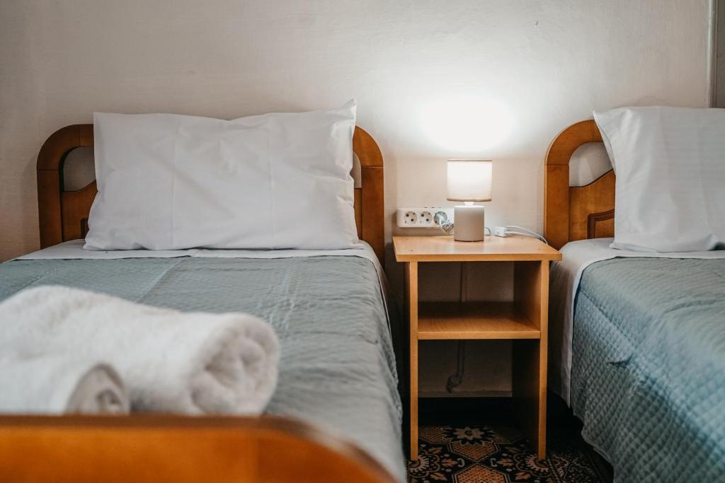 Postel nebo postele na pokoji v ubytování Guest House Edmond
