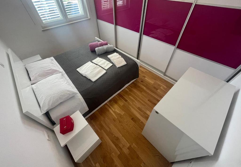 Postel nebo postele na pokoji v ubytování Apartman Popović