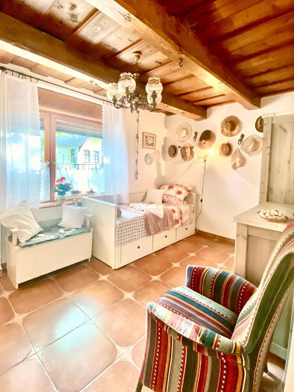a small bedroom with a bed and a window at Lavender Cottage in Balatongyörök