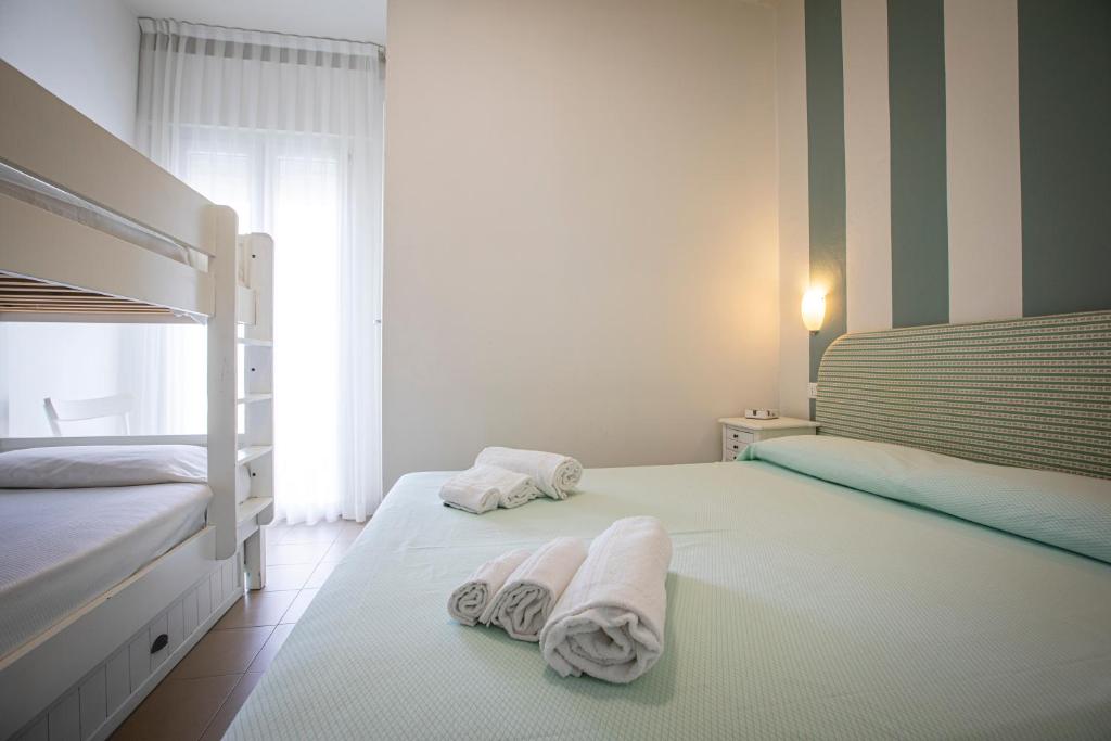 Postel nebo postele na pokoji v ubytování Hotel Ronchi