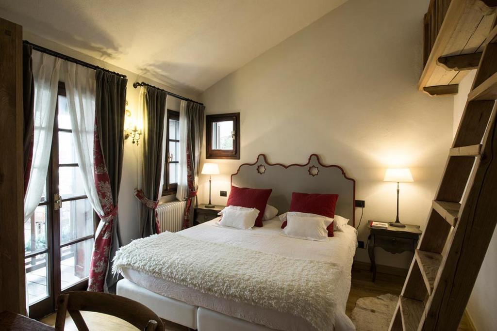 Postel nebo postele na pokoji v ubytování Locanda La Brenva - Estella Hotel Collection & Experience