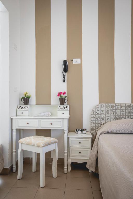 Postel nebo postele na pokoji v ubytování Hotel Ronchi