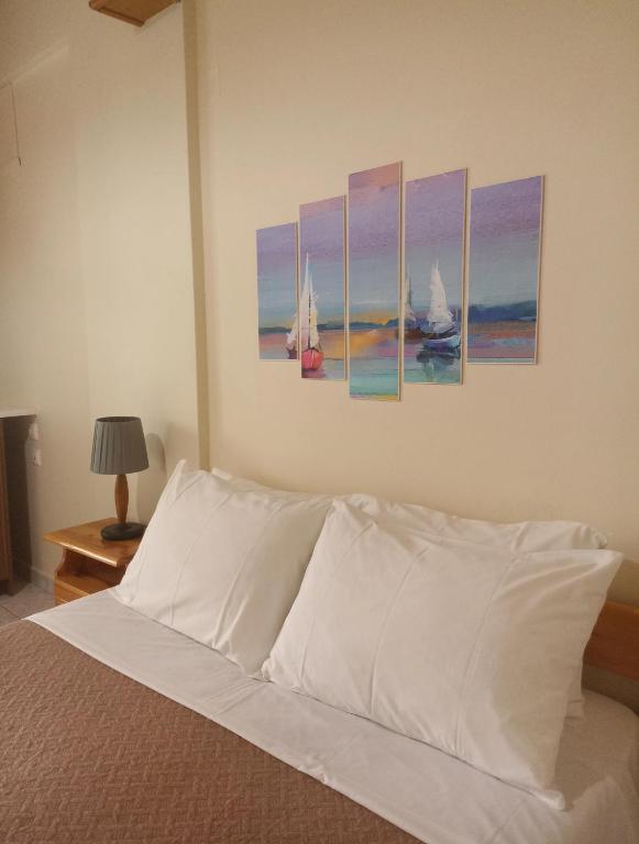 Postel nebo postele na pokoji v ubytování Zois Apartments