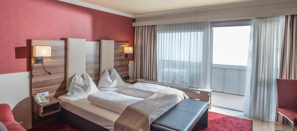 Posteľ alebo postele v izbe v ubytovaní Hotel Kufsteinerhof