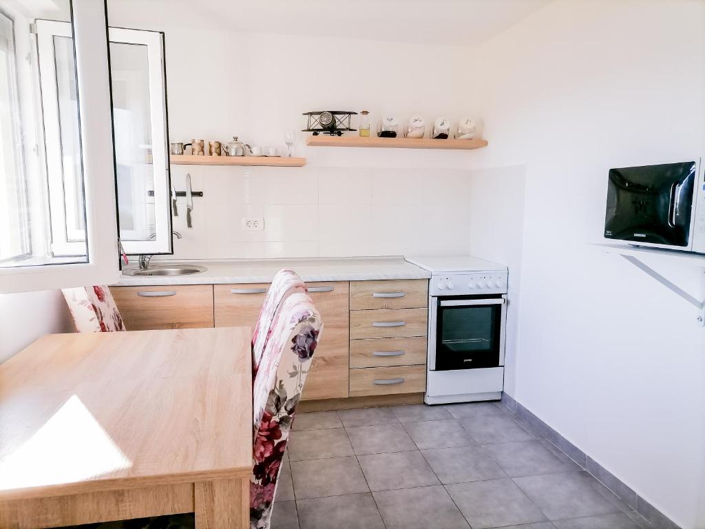 Kuchyň nebo kuchyňský kout v ubytování Apartments Siesta
