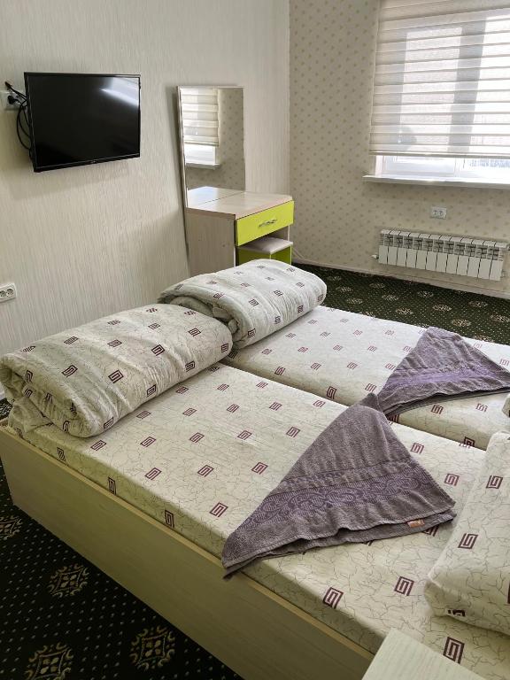 Postel nebo postele na pokoji v ubytování Anisa- Hostel