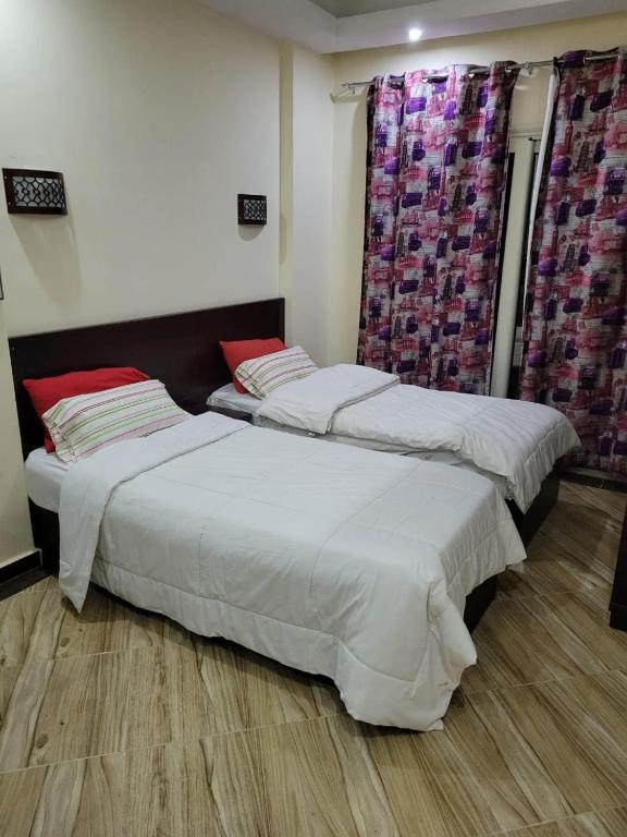Postel nebo postele na pokoji v ubytování Cecelia Beach Resort Furnished Chalets for Rent