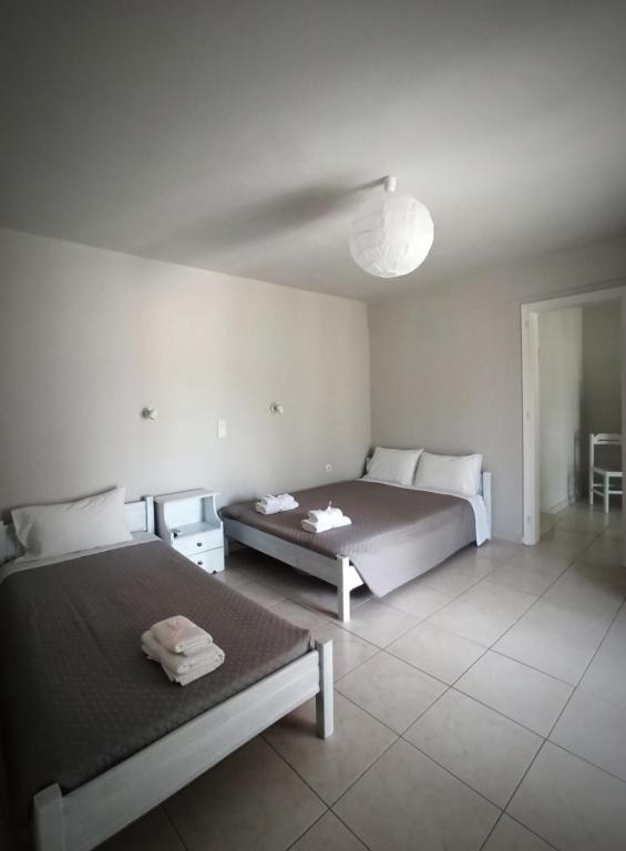 Postel nebo postele na pokoji v ubytování Demis Apartments