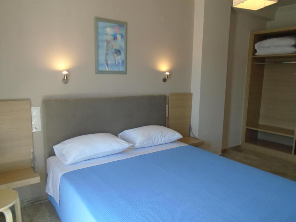 Postel nebo postele na pokoji v ubytování Polyxeni Hotel