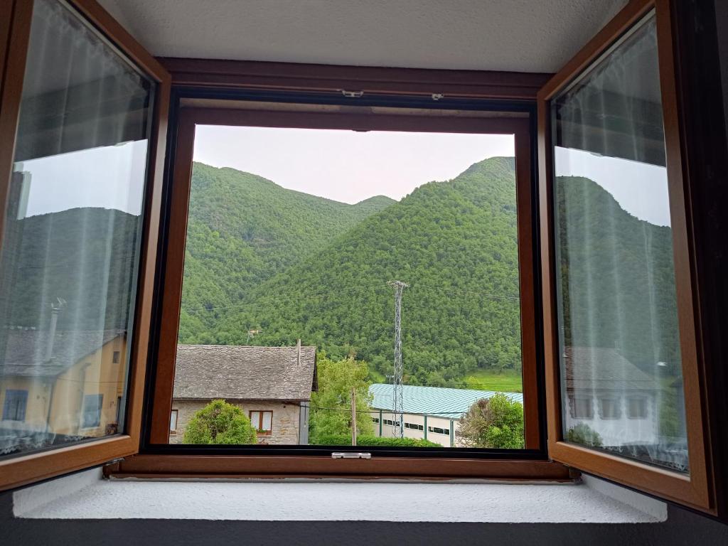 a window with a view of a mountain at VUT Corea324 in Caboalles de Abajo