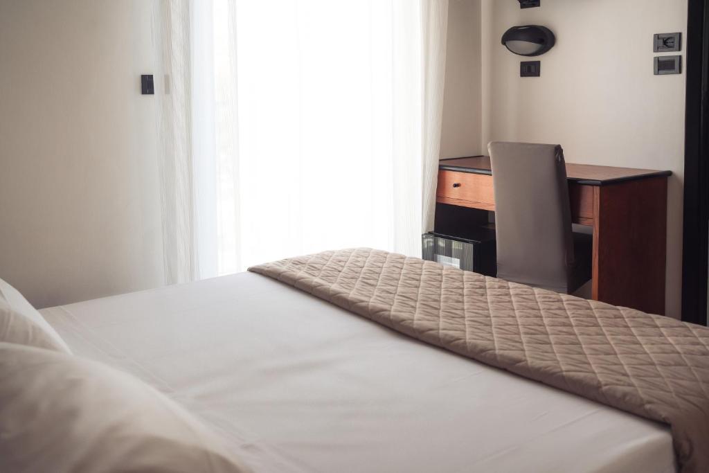 Postel nebo postele na pokoji v ubytování Lime Hotel