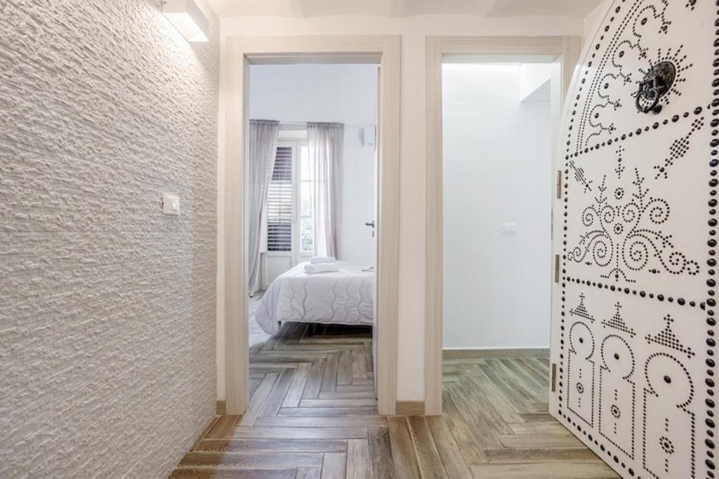 Posteľ alebo postele v izbe v ubytovaní Calypso Il Binario Elegance