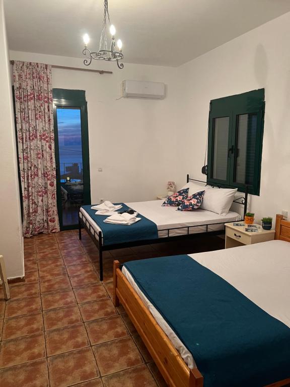 Postel nebo postele na pokoji v ubytování Georgakas rooms
