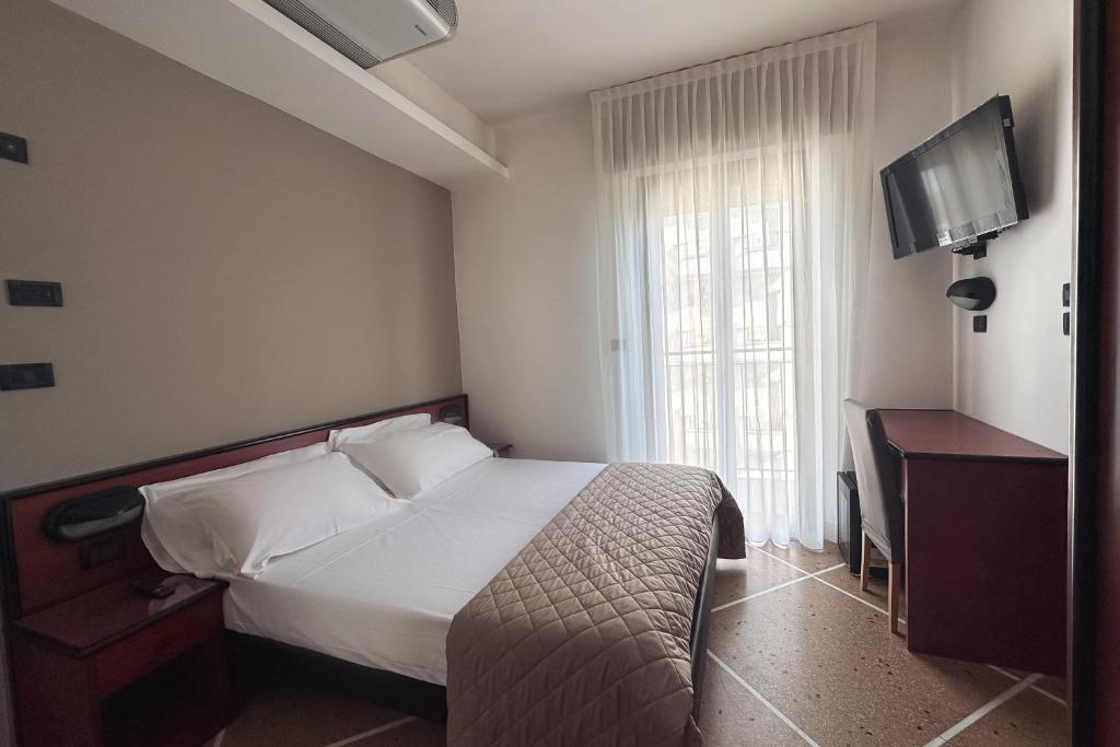 Postel nebo postele na pokoji v ubytování Lime Hotel
