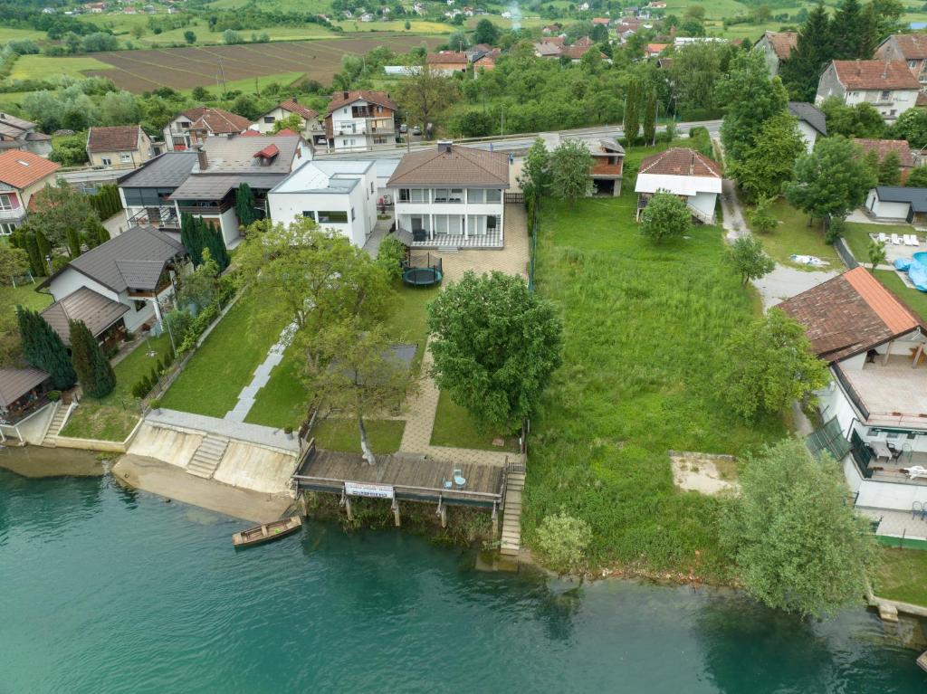 an aerial view of a house next to the water at Villa Al Nemah in Bihać