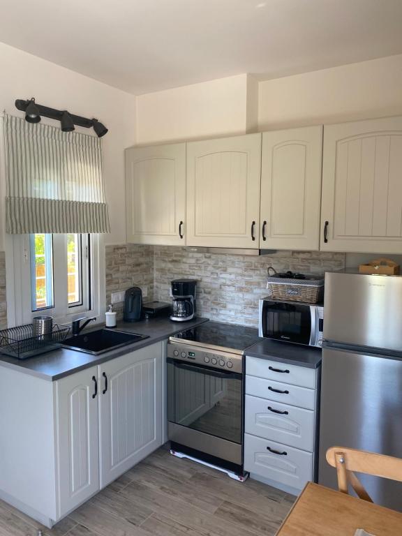 Kuchyň nebo kuchyňský kout v ubytování Philia Apartment