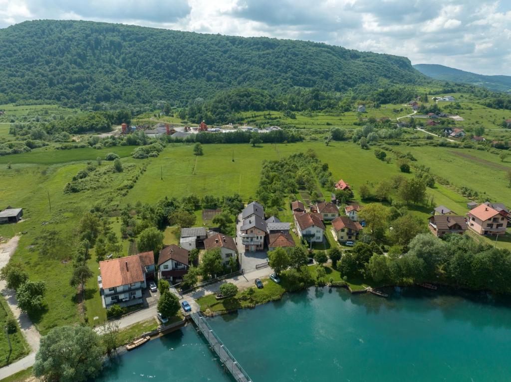 an aerial view of a house next to a river at Amina River Apartment in Bihać