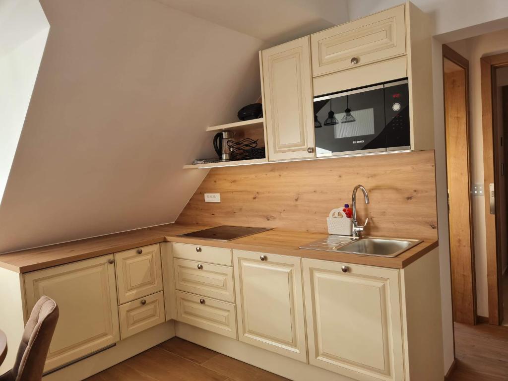 Kuchyň nebo kuchyňský kout v ubytování New Apartments Teravila