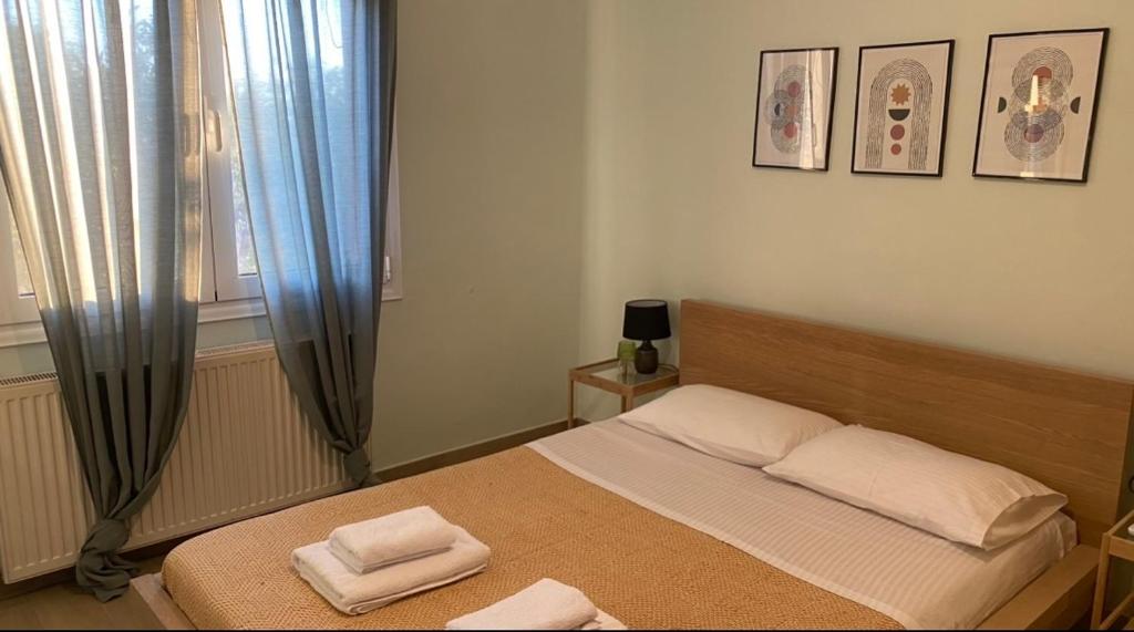 Ένα ή περισσότερα κρεβάτια σε δωμάτιο στο Theros Garden House