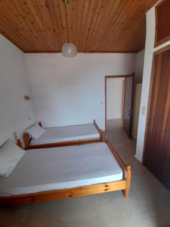 Postel nebo postele na pokoji v ubytování Christina Sunny Rooms