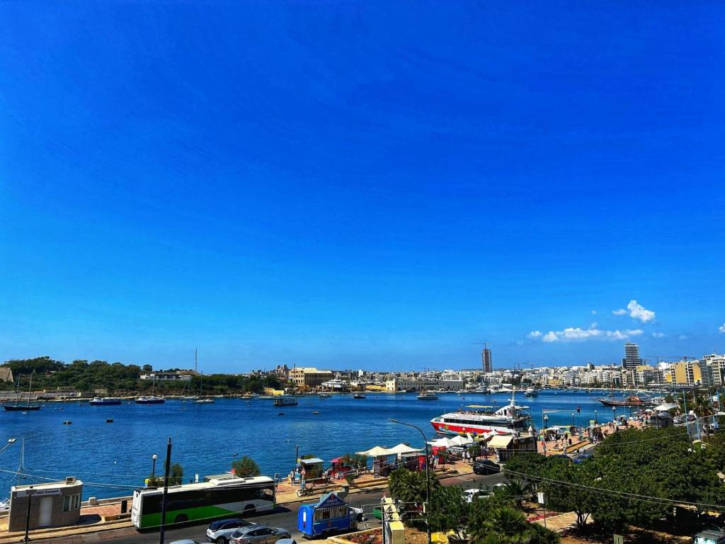 a view of a harbor with boats in the water at Galileo Rooms in Il- Gżira