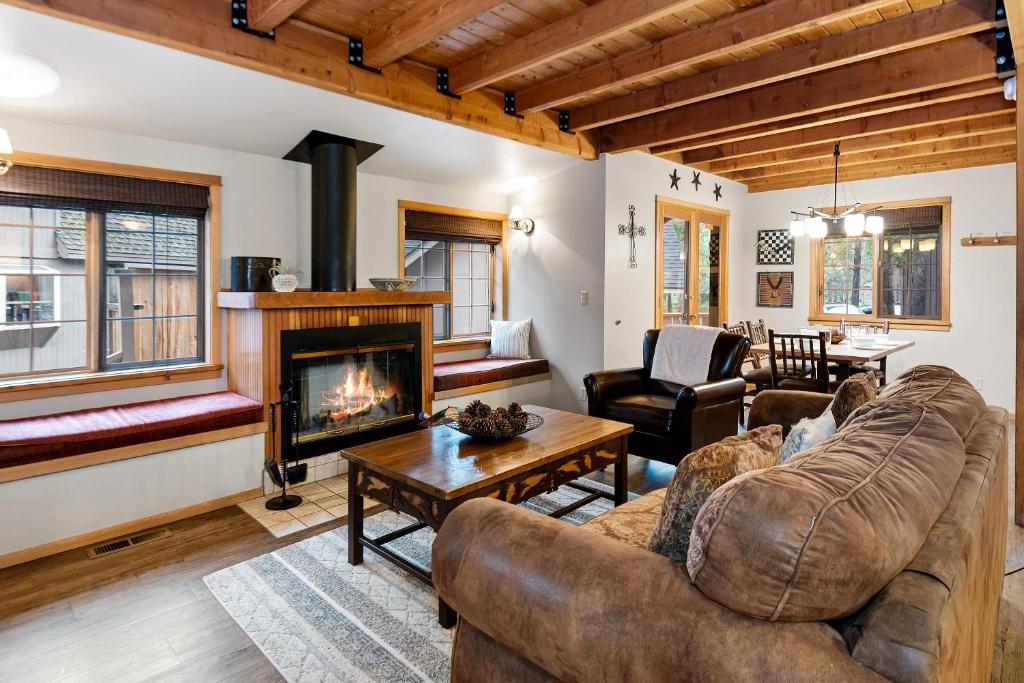 a living room with a couch and a fireplace at 18 Deer Lane in Sunriver