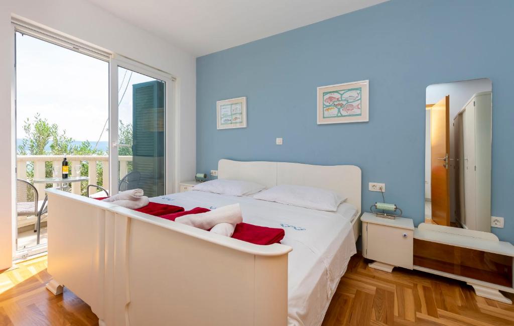 Postel nebo postele na pokoji v ubytování Apartments Djani