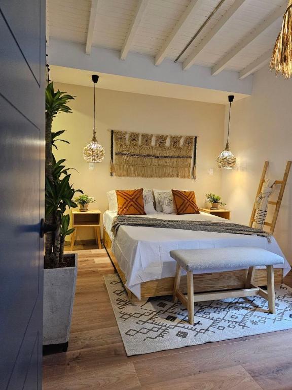 Postel nebo postele na pokoji v ubytování Poblado Luum Boutique hotel