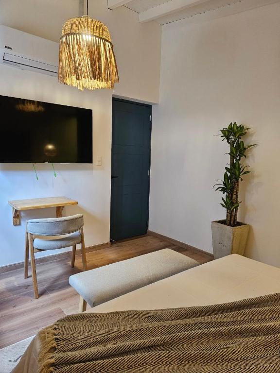 Postel nebo postele na pokoji v ubytování Poblado Luum Boutique hotel