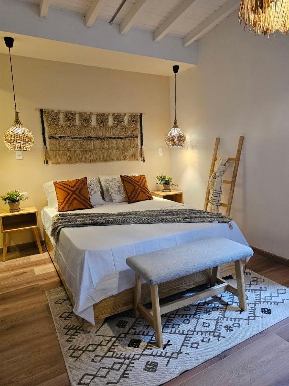 Postel nebo postele na pokoji v ubytování Poblado Luum Boutique hotel