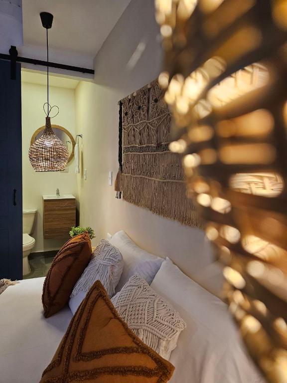 Postel nebo postele na pokoji v ubytování Poblado Luum Boutique hotel