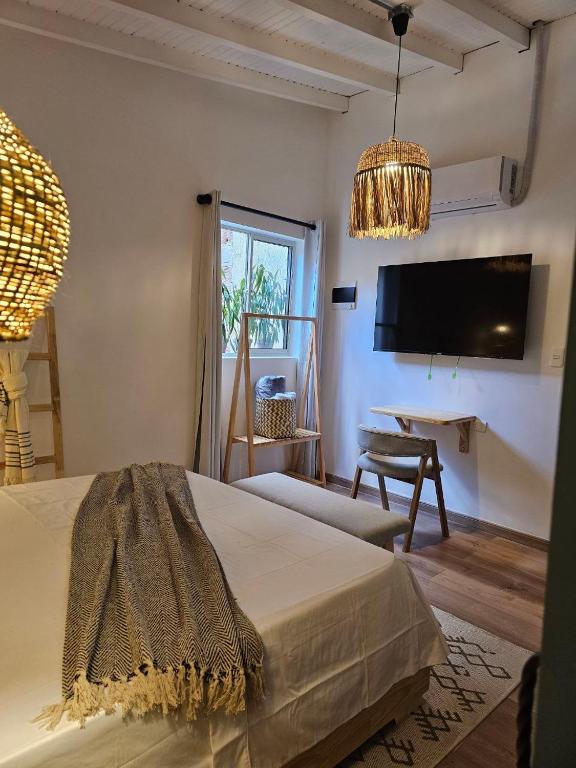 TV a/nebo společenská místnost v ubytování Poblado Luum Boutique hotel