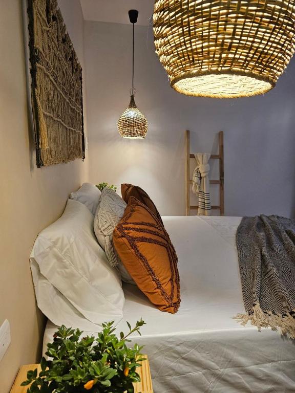 Postel nebo postele na pokoji v ubytování Poblado Luum Boutique hotel